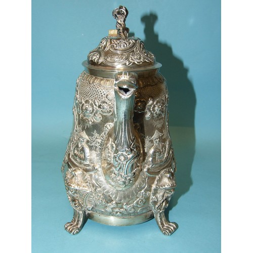 523 - A Regency coffee pot of slightly-bellied form, the figural finialled lid and shaped ivory handle to ... 