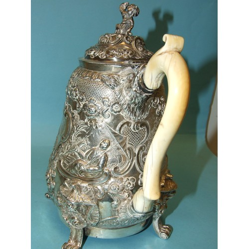 523 - A Regency coffee pot of slightly-bellied form, the figural finialled lid and shaped ivory handle to ... 