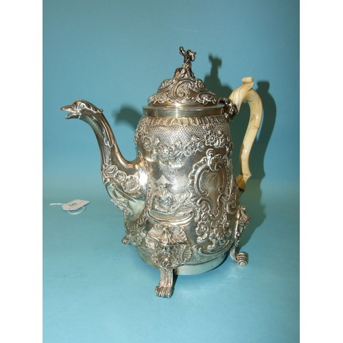 523 - A Regency coffee pot of slightly-bellied form, the figural finialled lid and shaped ivory handle to ... 