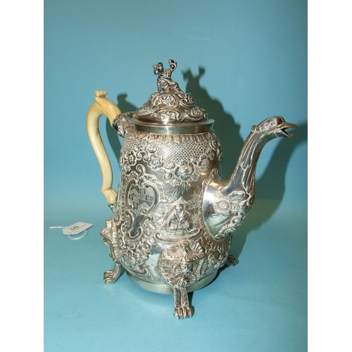 523 - A Regency coffee pot of slightly-bellied form, the figural finialled lid and shaped ivory handle to ... 