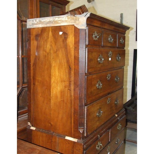 111 - A George II walnut chest on chest, the cornice above three small and three long feather-banded drawe... 