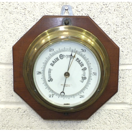 115 - A 20th century brass bulkhead barometer by John Barker, 22cm diameter and a Sestrel brass ship's clo... 