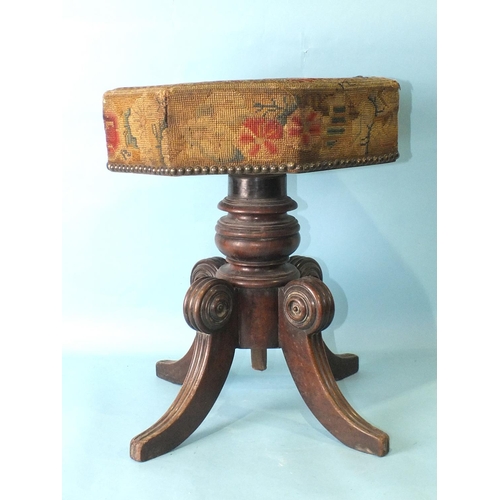 78 - An early-19th century mahogany music stool, the revolving adjustable seat, with original needlework ... 