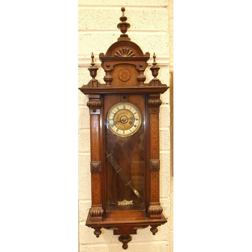 83 - A late-Victorian walnut-cased Vienna-style wall clock, the pedimented case painted to simulate marqu... 