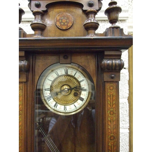 83 - A late-Victorian walnut-cased Vienna-style wall clock, the pedimented case painted to simulate marqu... 