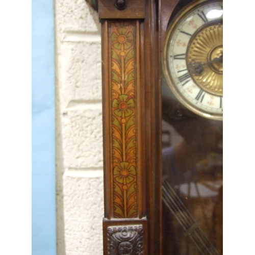 83 - A late-Victorian walnut-cased Vienna-style wall clock, the pedimented case painted to simulate marqu... 