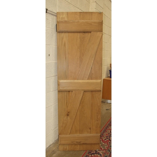 93 - A well-constructed contemporary oak internal door with metal latch fitting and hinges, 200 x 84.5cm ... 