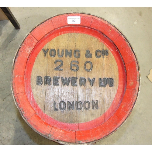 92 - An oak and metal-bound beer barrel stamped Young & Co. Brewery Ltd, London, 53cm high.... 