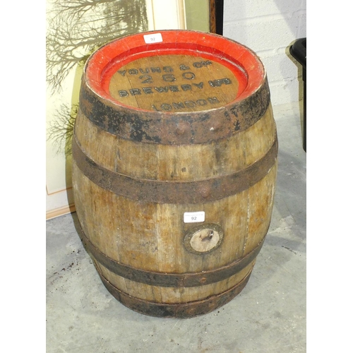 92 - An oak and metal-bound beer barrel stamped Young & Co. Brewery Ltd, London, 53cm high.... 