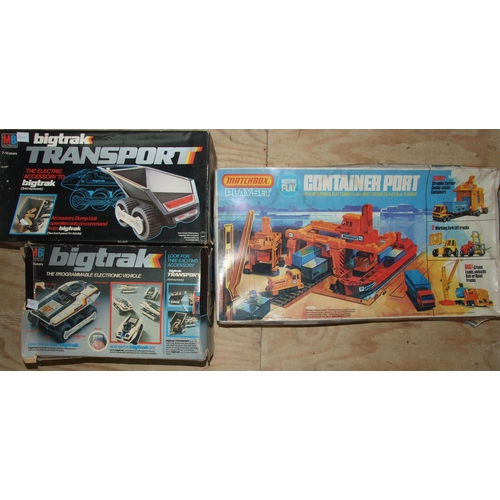 426 - Big Trak Programmable Electronic Vehicle and Big Trak Transport, both boxed and a Matchbox Container... 