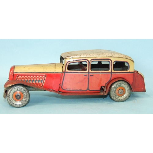 431 - A Mettoy tinplate c/w limousine with cream and red body and 'Dunlop 90' balloon tyres, 27cm long, (s... 