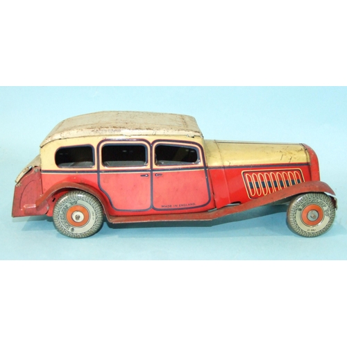 431 - A Mettoy tinplate c/w limousine with cream and red body and 'Dunlop 90' balloon tyres, 27cm long, (s... 