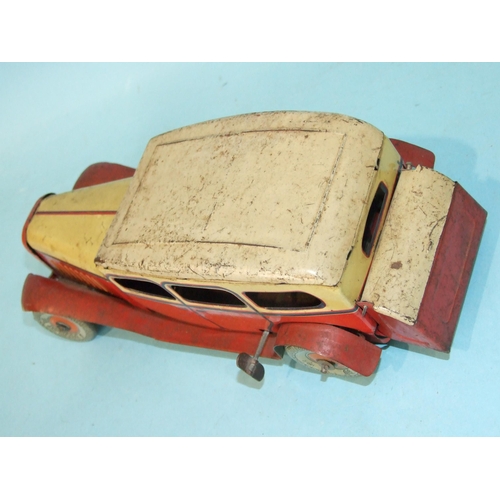 431 - A Mettoy tinplate c/w limousine with cream and red body and 'Dunlop 90' balloon tyres, 27cm long, (s... 