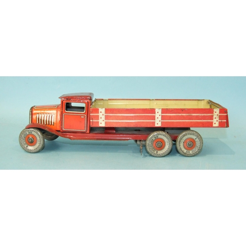 432 - A Mettoy tinplate c/w six-wheel tipper, red and cream, with 'Dunlop 90' balloon tyres, 32cm long.... 