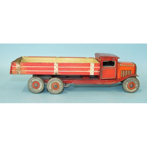 432 - A Mettoy tinplate c/w six-wheel tipper, red and cream, with 'Dunlop 90' balloon tyres, 32cm long.... 