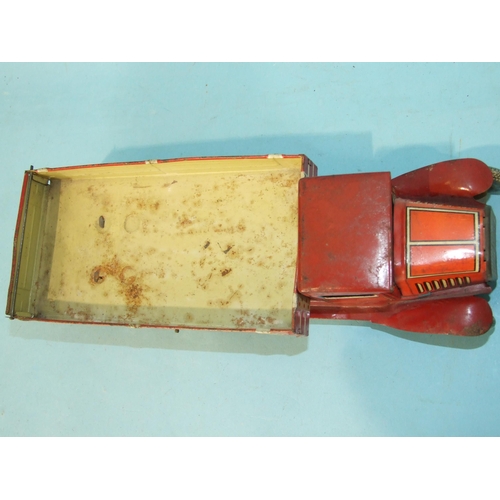 432 - A Mettoy tinplate c/w six-wheel tipper, red and cream, with 'Dunlop 90' balloon tyres, 32cm long.... 