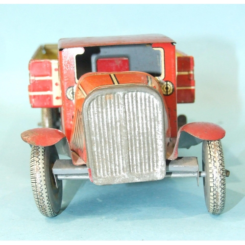 432 - A Mettoy tinplate c/w six-wheel tipper, red and cream, with 'Dunlop 90' balloon tyres, 32cm long.... 