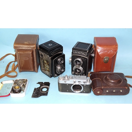 471 - An Airesflex TLR camera with case, a Yashic-A TLR (a/f), cased and a Zorki camera body, with case.... 