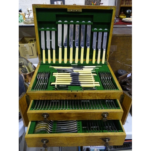 101 - A near-complete twelve-setting canteen of cutlery by Lee & Wigfull Ltd, contained in an oak fitt... 