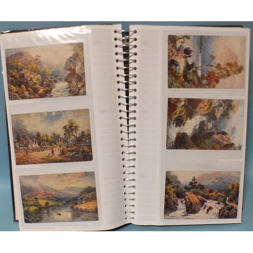 123 - An album of approximately 200 illustrated scenic postcards, mainly Tucks, by artists Jotter (x77), A... 