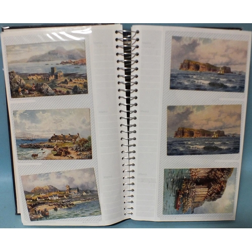 123 - An album of approximately 200 illustrated scenic postcards, mainly Tucks, by artists Jotter (x77), A... 