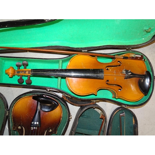 124 - A full-size violin in case, (a/f), with two bows and two other later violins in cases, (a/f), (3).... 