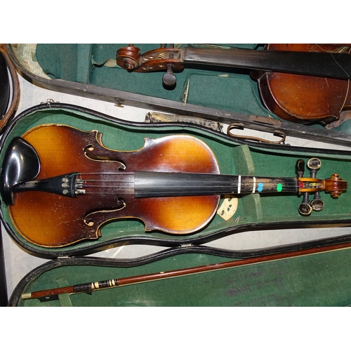 124 - A full-size violin in case, (a/f), with two bows and two other later violins in cases, (a/f), (3).... 