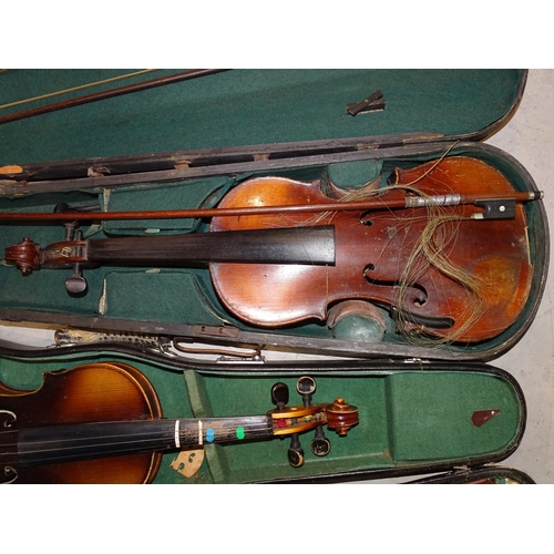 124 - A full-size violin in case, (a/f), with two bows and two other later violins in cases, (a/f), (3).... 