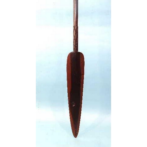 138 - A 20th century African hardwood ceremonial spear, the shaft flared at the base, 128cm long.... 