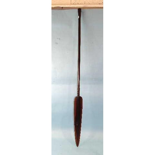 138 - A 20th century African hardwood ceremonial spear, the shaft flared at the base, 128cm long.... 