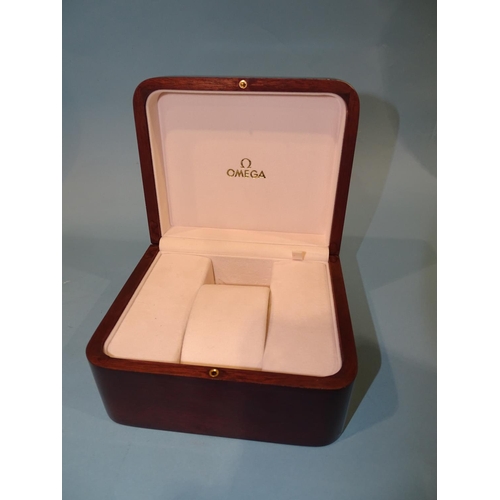 162 - An Omega wooden box for a gentleman's wrist watch, 14cm wide, 8.5cm high, 12cm deep.... 