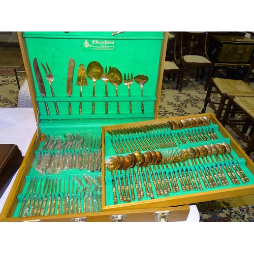 205 - S Samran Thailand Co. Ltd, a twelve-piece place setting canteen of bronzed cutlery, in fitted box, (... 