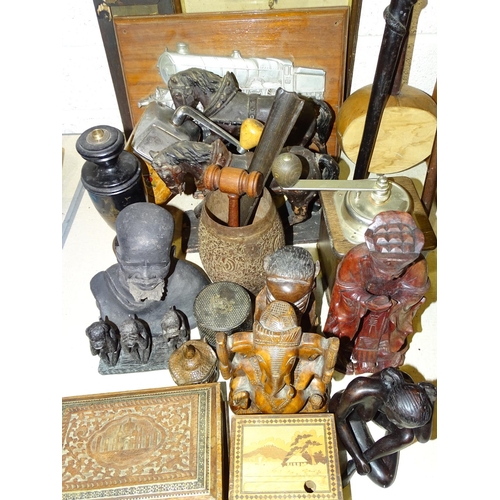 65 - A collection of wooden items, including a tribal carved walking stick, figures and miscellaneous ite... 