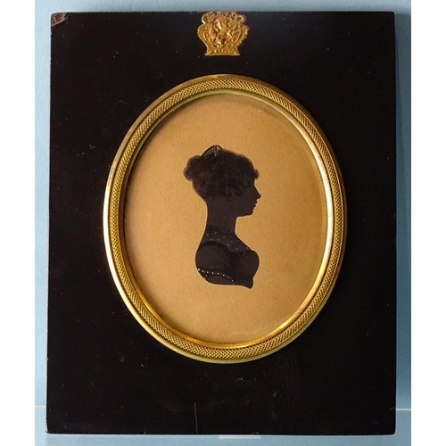 101 - Edward Foster (1762-1864), an early-19th century painted silhouette on card of an unknown woman, in ... 