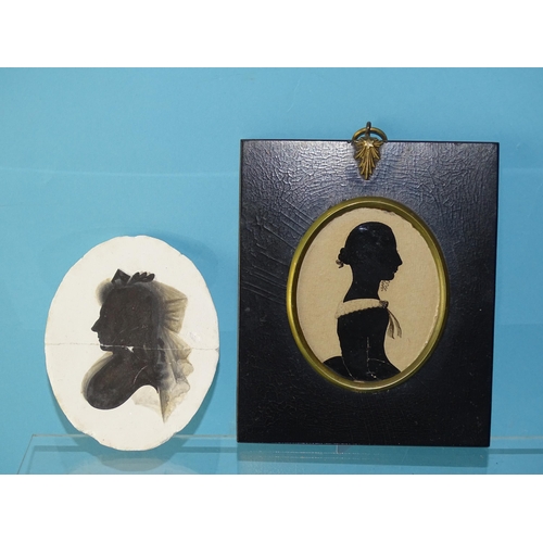 110 - A 19th century silhouette painted on card of an unknown woman, 75 x 60mm, with partial label of Warr... 