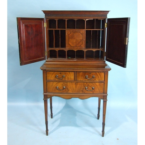 150 - A Maple & Co. mahogany cabinet on stand, the bullet-moulded frieze above a pair of panelled door... 