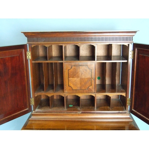 150 - A Maple & Co. mahogany cabinet on stand, the bullet-moulded frieze above a pair of panelled door... 