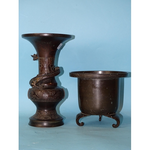 209 - A 19th century Japanese bronze tripod censer and a bronze vase of baluster form with an applied drag... 