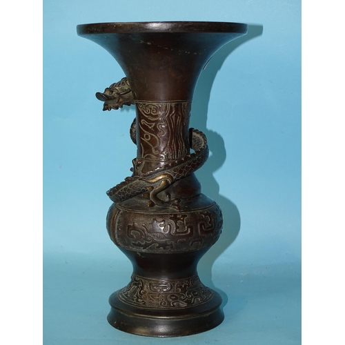 209 - A 19th century Japanese bronze tripod censer and a bronze vase of baluster form with an applied drag... 