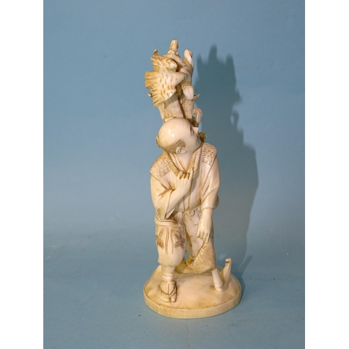 211 - A Japanese ivory figure of a man collecting maize, Meiji, 14cm high, (red seal mark to base).... 