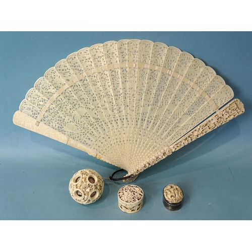 212 - A 19th century Chinese ivory pierced fan, a silver-mounted Canton ivory oval box, one other box and ... 