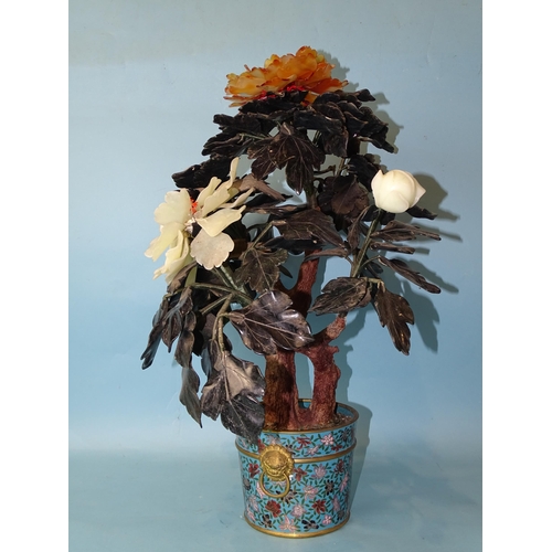 216 - A 20th century Oriental hardstone tree peony contained in a cloisonné-decorated circular pot, 57cm h... 