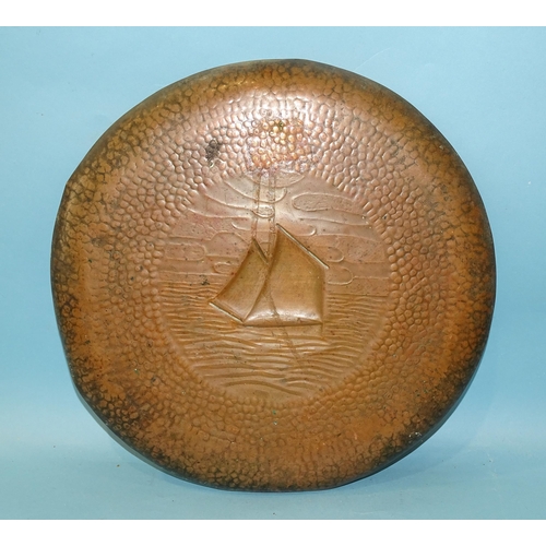 219 - A Newlyn copper circular tray with embossed lugger decoration, impressed mark NEWLYN, 33.5cm diamete... 