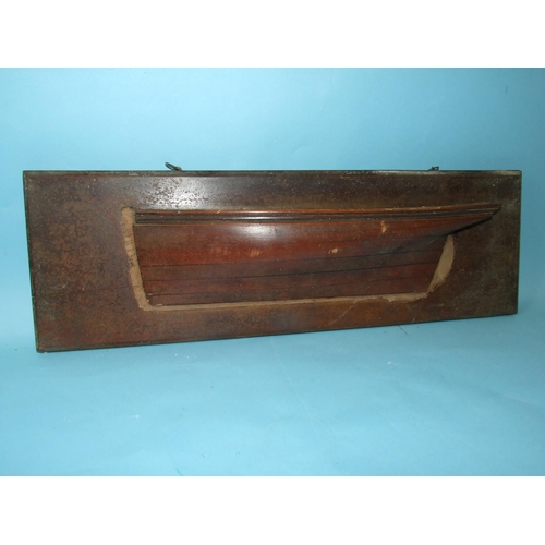 222 - An early-20th century laminated half-block model of a boat hull, (comb and rudder lacking), 48cm lon... 