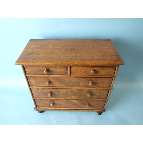 225 - A late-Victorian mahogany miniature straight-front chest of two short and three long drawers, on tur... 