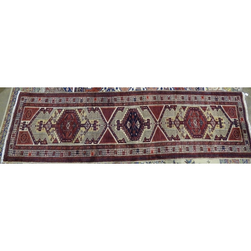 226 - A modern Oriental corridor runner with central serrated lozenges on a camel ground, 350cm long, 103c... 