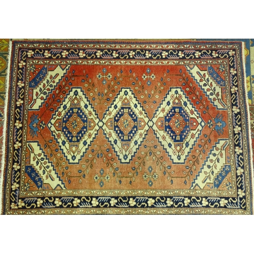 227 - A modern Oriental rug with central pole medallion and foliate spandrels on a brick red ground, 210 x... 