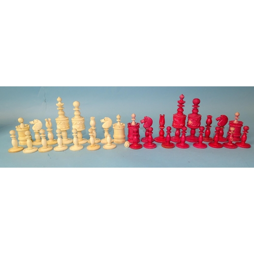 229 - A late-19th century carved  and stained bone chess set, one white pawn missing, small damages, in ma... 