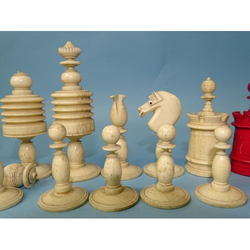 229 - A late-19th century carved  and stained bone chess set, one white pawn missing, small damages, in ma... 