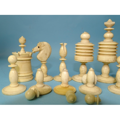 229 - A late-19th century carved  and stained bone chess set, one white pawn missing, small damages, in ma... 